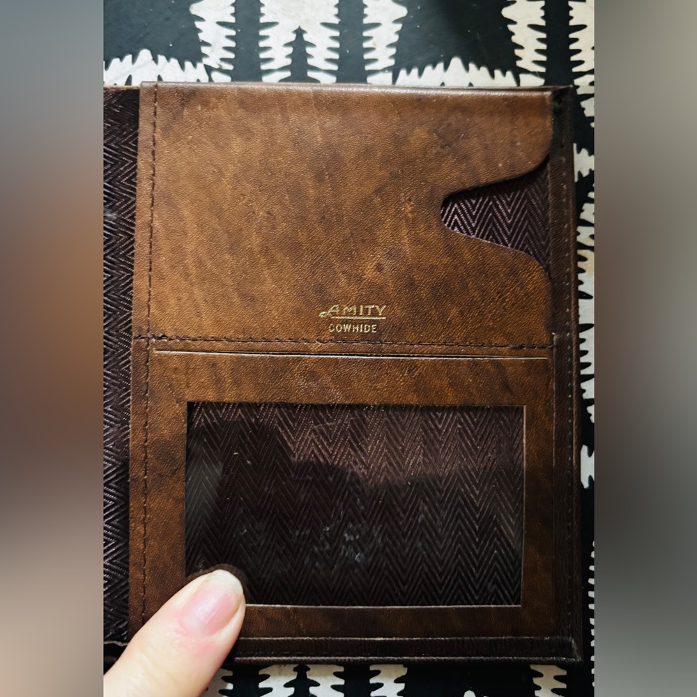 "AMITY COWHIDE" branding visible, this item is a vintage brown leather wallet